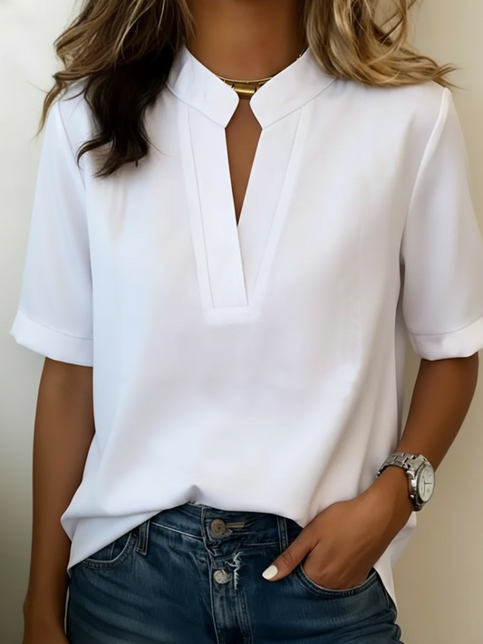 Noëlle | Elegante blouse met V-hals en gouden detail